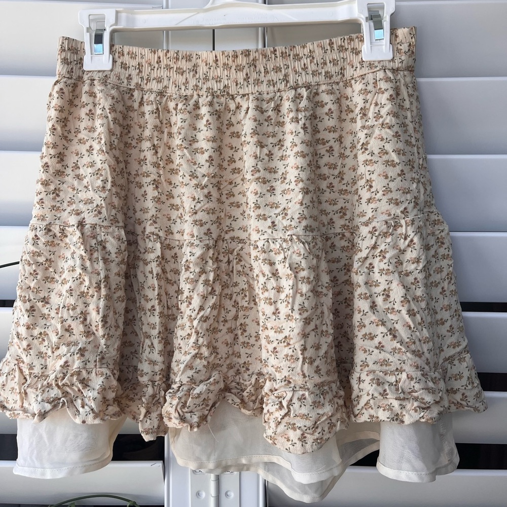 cream colored flowy mini skirt